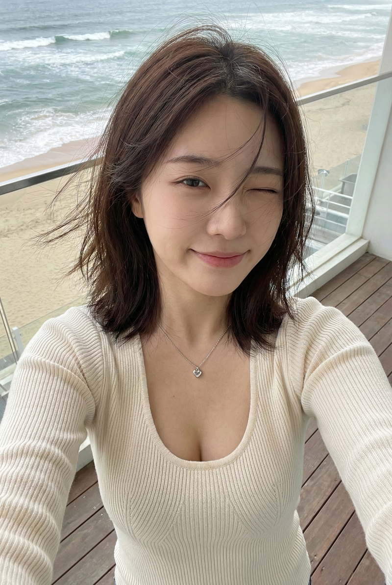 { "subject": { "description": "A young Asian woman taking a high-angle selfie on