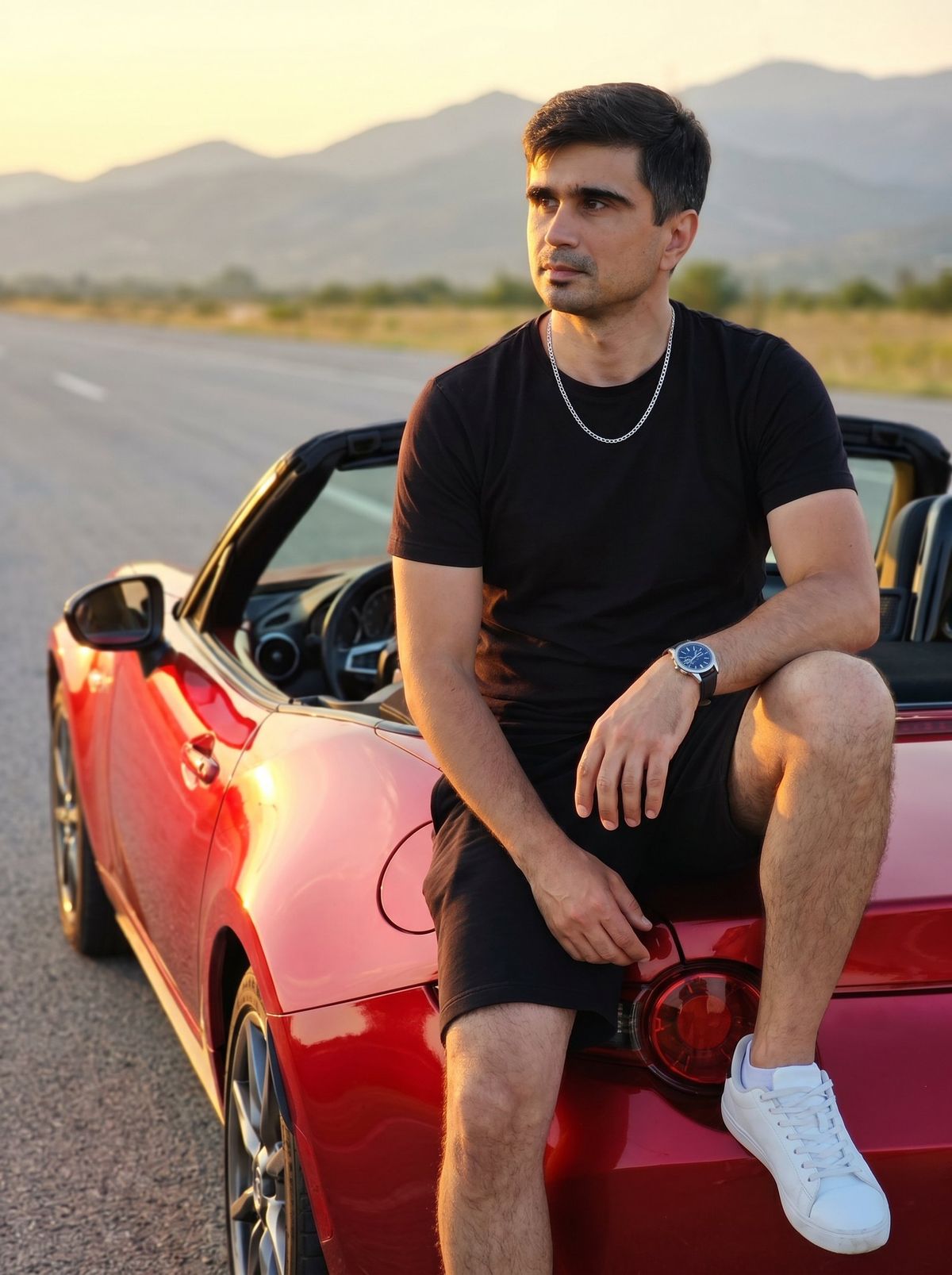 Man on Red Convertible Sports Car